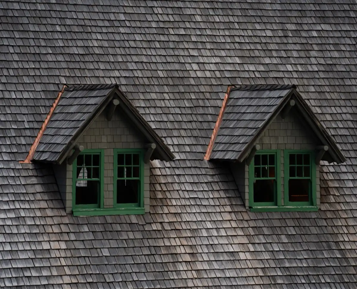 Dormers on a shingle roof in Lake Havasu City, AZ, where step flashing and kickout flashing carry water past the walls